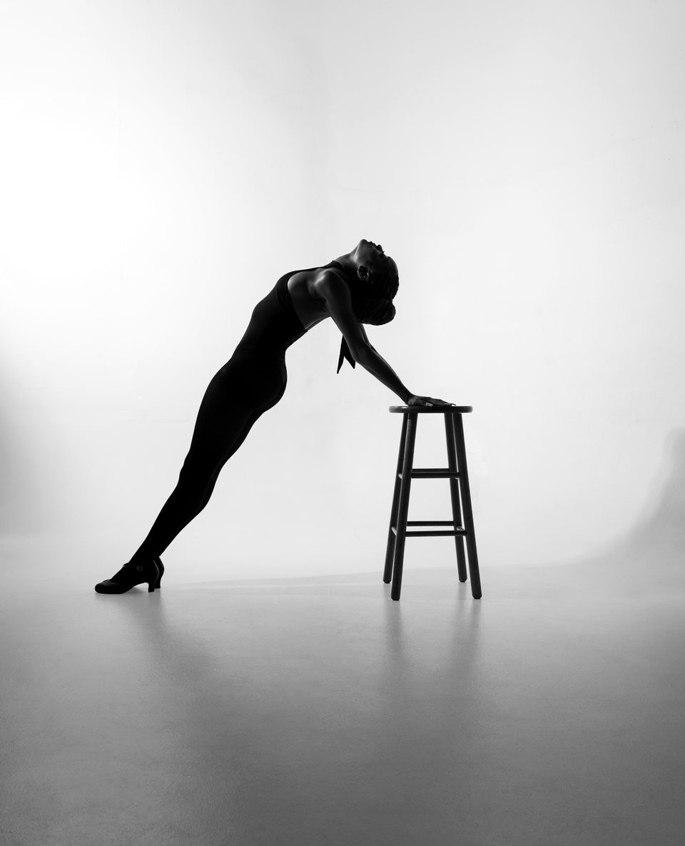 Silhouette, tilt over a stool