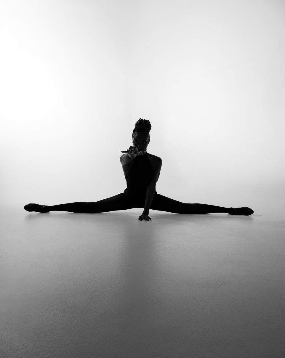 Silhouette, floor split with arms overhead